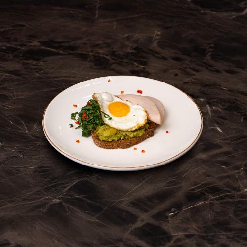 Avocado, Smoked Turkey, and Fried Egg on Bread