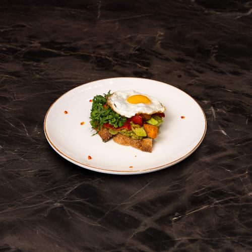 Bread with Avocado, Grilled Vegetables, and a Sunny-Side-Up Egg