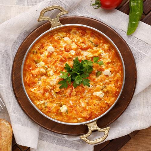 Menemen with white cheese, cooked in a pan