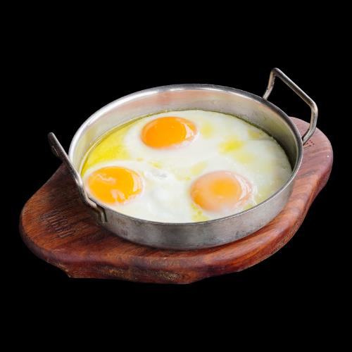 Butter-fried sunny-side-up eggs